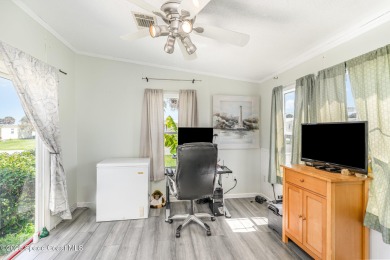 Welcome to your slice of paradise in Barefoot Bay! This charming on Barefoot Bay Golf Course in Florida - for sale on GolfHomes.com, golf home, golf lot