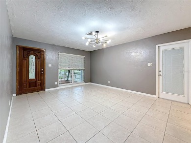 Discover this beautifully renovated 4-bedroom, 2-bathroom home on Temple Terrace Golf and Country Club in Florida - for sale on GolfHomes.com, golf home, golf lot