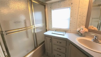 CHEERFUL HOME IN ACTIVE 55+ COMMUNITY! This one bed, two bath on River Run Golf Links in Florida - for sale on GolfHomes.com, golf home, golf lot