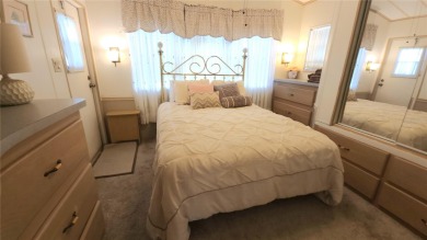 CHEERFUL HOME IN ACTIVE 55+ COMMUNITY! This one bed, two bath on River Run Golf Links in Florida - for sale on GolfHomes.com, golf home, golf lot