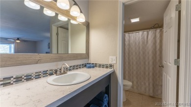 Welcome to Tan Tar A Estates! This 3 bedroom, 4 bathroom home is on The Oaks Golf Course in Missouri - for sale on GolfHomes.com, golf home, golf lot