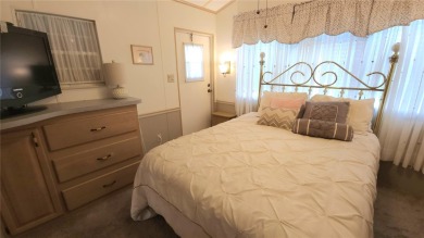 CHEERFUL HOME IN ACTIVE 55+ COMMUNITY! This one bed, two bath on River Run Golf Links in Florida - for sale on GolfHomes.com, golf home, golf lot