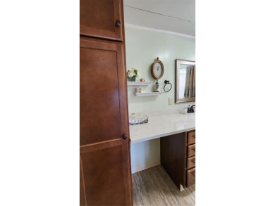 CHEERFUL HOME IN ACTIVE 55+ COMMUNITY! This one bed, two bath on River Run Golf Links in Florida - for sale on GolfHomes.com, golf home, golf lot