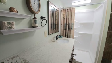 CHEERFUL HOME IN ACTIVE 55+ COMMUNITY! This one bed, two bath on River Run Golf Links in Florida - for sale on GolfHomes.com, golf home, golf lot