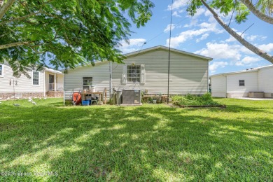 Welcome to your slice of paradise in Barefoot Bay! This charming on Barefoot Bay Golf Course in Florida - for sale on GolfHomes.com, golf home, golf lot