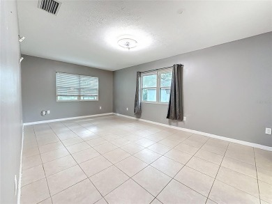 Discover this beautifully renovated 4-bedroom, 2-bathroom home on Temple Terrace Golf and Country Club in Florida - for sale on GolfHomes.com, golf home, golf lot