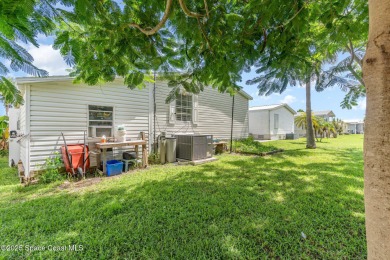 Welcome to your slice of paradise in Barefoot Bay! This charming on Barefoot Bay Golf Course in Florida - for sale on GolfHomes.com, golf home, golf lot