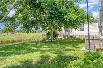 Welcome to your slice of paradise in Barefoot Bay! This charming on Barefoot Bay Golf Course in Florida - for sale on GolfHomes.com, golf home, golf lot