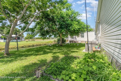 Welcome to your slice of paradise in Barefoot Bay! This charming on Barefoot Bay Golf Course in Florida - for sale on GolfHomes.com, golf home, golf lot