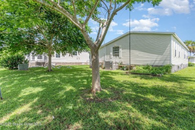 Welcome to your slice of paradise in Barefoot Bay! This charming on Barefoot Bay Golf Course in Florida - for sale on GolfHomes.com, golf home, golf lot