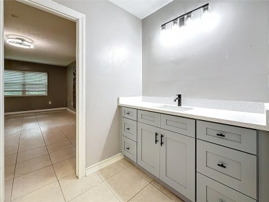 Discover this beautifully renovated 4-bedroom, 2-bathroom home on Temple Terrace Golf and Country Club in Florida - for sale on GolfHomes.com, golf home, golf lot