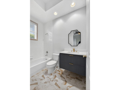 Set on a private cul-de-sac in the boutique Ironhorse community on Ironhorse Country Club in Florida - for sale on GolfHomes.com, golf home, golf lot