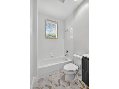 Set on a private cul-de-sac in the boutique Ironhorse community on Ironhorse Country Club in Florida - for sale on GolfHomes.com, golf home, golf lot