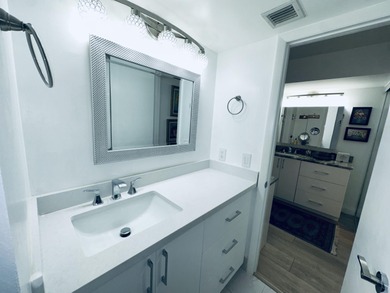 BEAUTIFUL CORNER UNIT WITH EAST EXPOSURE, LAKE, GOLF COURSE, AND on  in Florida - for sale on GolfHomes.com, golf home, golf lot