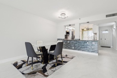 Come see this stunning, move-in-ready unit in Bonaire Village! on Marina Lakes Golf Course in Florida - for sale on GolfHomes.com, golf home, golf lot