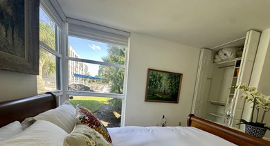 BEAUTIFUL CORNER UNIT WITH EAST EXPOSURE, LAKE, GOLF COURSE, AND on  in Florida - for sale on GolfHomes.com, golf home, golf lot