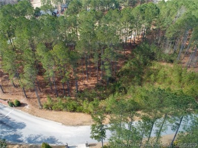 This wooded golf front home site is located in the gated on Anderson Creek Golf Club in North Carolina - for sale on GolfHomes.com, golf home, golf lot