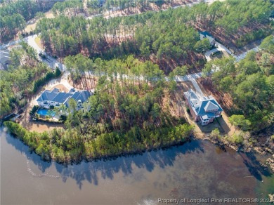 This wooded golf front home site is located in the gated on Anderson Creek Golf Club in North Carolina - for sale on GolfHomes.com, golf home, golf lot