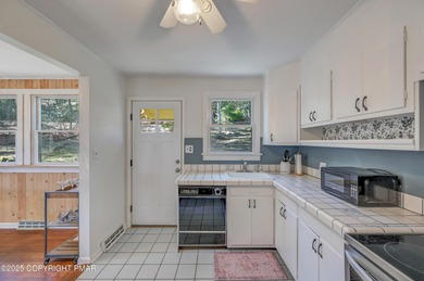 This charming three-bedroom, two-and-a-half-bathroom cottage on Buck Hill Golf Club  in Pennsylvania - for sale on GolfHomes.com, golf home, golf lot