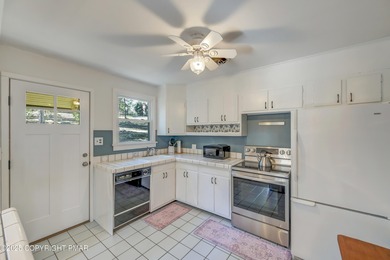 This charming three-bedroom, two-and-a-half-bathroom cottage on Buck Hill Golf Club  in Pennsylvania - for sale on GolfHomes.com, golf home, golf lot