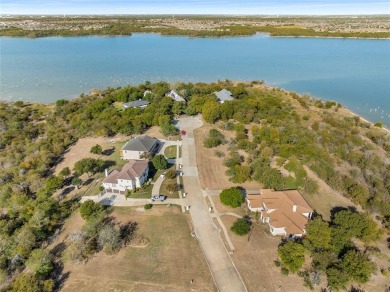 Discover the beauty of Joe Pool Lake with this one-of-a-kind on Tangle Ridge Golf Club in Texas - for sale on GolfHomes.com, golf home, golf lot