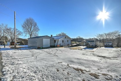 Great investment property/fixer upper with plenty of outdoor on The Crossings Golf Club in Tennessee - for sale on GolfHomes.com, golf home, golf lot