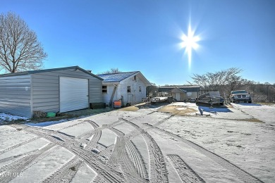 Great investment property/fixer upper with plenty of outdoor on The Crossings Golf Club in Tennessee - for sale on GolfHomes.com, golf home, golf lot