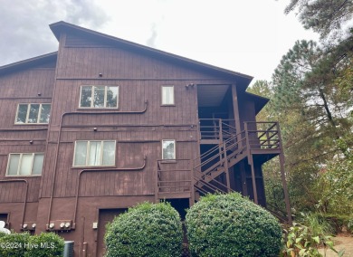 Top-floor condo with stunning views of the 8th hole at Highland on Hyland Golf Club in North Carolina - for sale on GolfHomes.com, golf home, golf lot