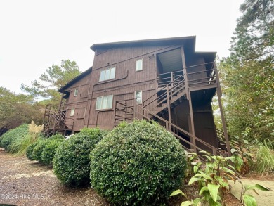 Top-floor condo with stunning views of the 8th hole at Highland on Hyland Golf Club in North Carolina - for sale on GolfHomes.com, golf home, golf lot