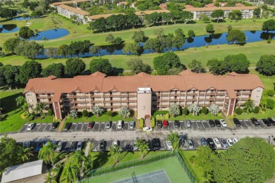 ENJOY ENDLESS GOLF COURSE VIEWS FROM YOUR FIRST FLOOR CONDO WITH on  in Florida - for sale on GolfHomes.com, golf home, golf lot