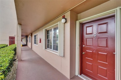 ENJOY ENDLESS GOLF COURSE VIEWS FROM YOUR FIRST FLOOR CONDO WITH on  in Florida - for sale on GolfHomes.com, golf home, golf lot