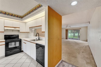 ENJOY ENDLESS GOLF COURSE VIEWS FROM YOUR FIRST FLOOR CONDO WITH on  in Florida - for sale on GolfHomes.com, golf home, golf lot