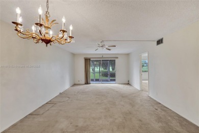 ENJOY ENDLESS GOLF COURSE VIEWS FROM YOUR FIRST FLOOR CONDO WITH on  in Florida - for sale on GolfHomes.com, golf home, golf lot