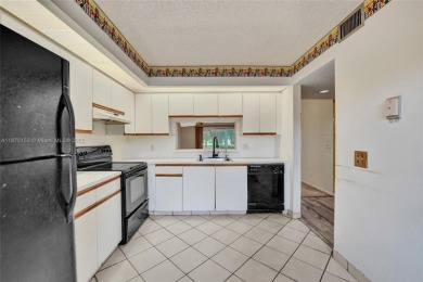 ENJOY ENDLESS GOLF COURSE VIEWS FROM YOUR FIRST FLOOR CONDO WITH on  in Florida - for sale on GolfHomes.com, golf home, golf lot