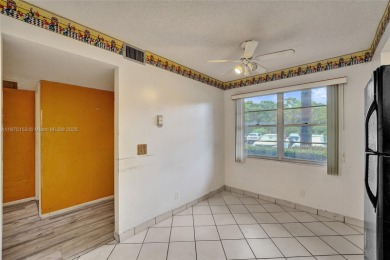 ENJOY ENDLESS GOLF COURSE VIEWS FROM YOUR FIRST FLOOR CONDO WITH on  in Florida - for sale on GolfHomes.com, golf home, golf lot