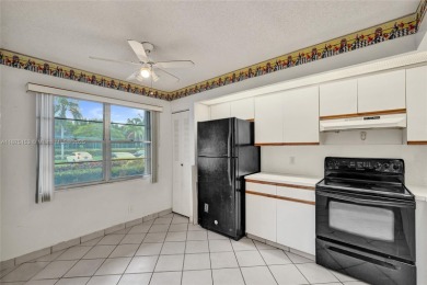 ENJOY ENDLESS GOLF COURSE VIEWS FROM YOUR FIRST FLOOR CONDO WITH on  in Florida - for sale on GolfHomes.com, golf home, golf lot