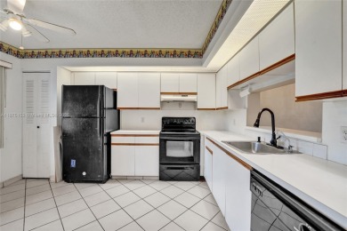 ENJOY ENDLESS GOLF COURSE VIEWS FROM YOUR FIRST FLOOR CONDO WITH on  in Florida - for sale on GolfHomes.com, golf home, golf lot
