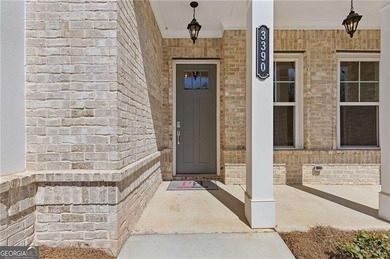 Nestled in the sought-after Traditions of Braselton community on Traditions of Braselton Golf Club in Georgia - for sale on GolfHomes.com, golf home, golf lot