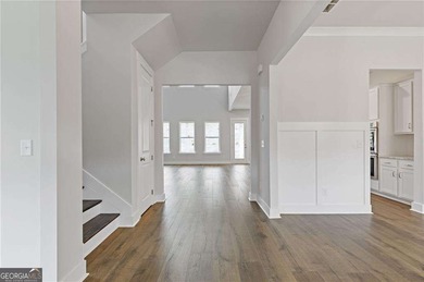 Nestled in the sought-after Traditions of Braselton community on Traditions of Braselton Golf Club in Georgia - for sale on GolfHomes.com, golf home, golf lot