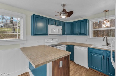 Welcome to your cozy Lake Mohawk retreat! This updated home sits on Lake Mohawk Golf Club in Ohio - for sale on GolfHomes.com, golf home, golf lot