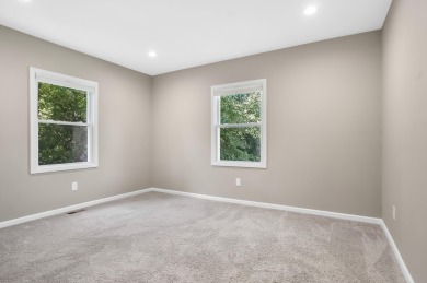 Spacious and updated, this 5-bedroom, 2-bathroom home offers 2 on IMA Brookwood Golf Course in Michigan - for sale on GolfHomes.com, golf home, golf lot