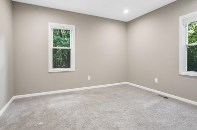 Spacious and updated, this 5-bedroom, 2-bathroom home offers 2 on IMA Brookwood Golf Course in Michigan - for sale on GolfHomes.com, golf home, golf lot