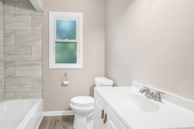 Spacious and updated, this 5-bedroom, 2-bathroom home offers 2 on IMA Brookwood Golf Course in Michigan - for sale on GolfHomes.com, golf home, golf lot