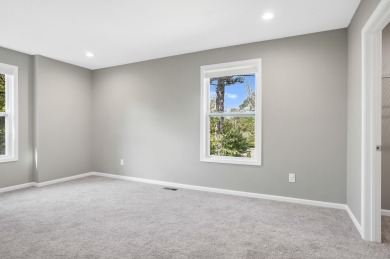 Spacious and updated, this 5-bedroom, 2-bathroom home offers 2 on IMA Brookwood Golf Course in Michigan - for sale on GolfHomes.com, golf home, golf lot