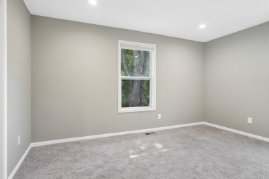 Spacious and updated, this 5-bedroom, 2-bathroom home offers 2 on IMA Brookwood Golf Course in Michigan - for sale on GolfHomes.com, golf home, golf lot