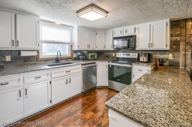 Nestled on an amazing nearly one-acre lot, this beautifully on Prairie Creek Golf Course in Michigan - for sale on GolfHomes.com, golf home, golf lot