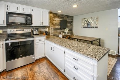 Nestled on an amazing nearly one-acre lot, this beautifully on Prairie Creek Golf Course in Michigan - for sale on GolfHomes.com, golf home, golf lot