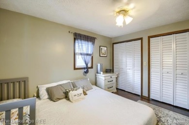 Nestled on an amazing nearly one-acre lot, this beautifully on Prairie Creek Golf Course in Michigan - for sale on GolfHomes.com, golf home, golf lot