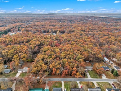 Discover the perfect blend of country living and convenience at on Eagle Island Golf Club in Michigan - for sale on GolfHomes.com, golf home, golf lot