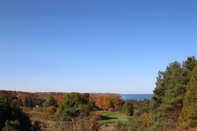 SPECTACULAR LAKE MICHIGAN VIEWS with beautiful views of the on Crooked Tree Golf Club in Michigan - for sale on GolfHomes.com, golf home, golf lot